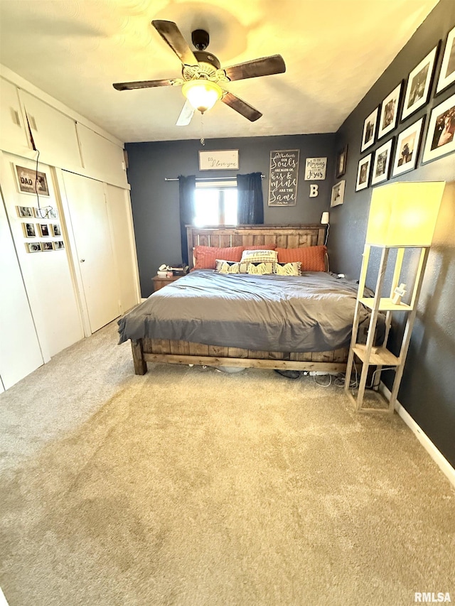 carpeted bedroom featuring a ceiling fan and a closet