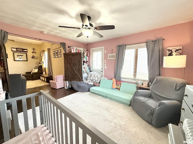 bedroom with ceiling fan and wood finished floors