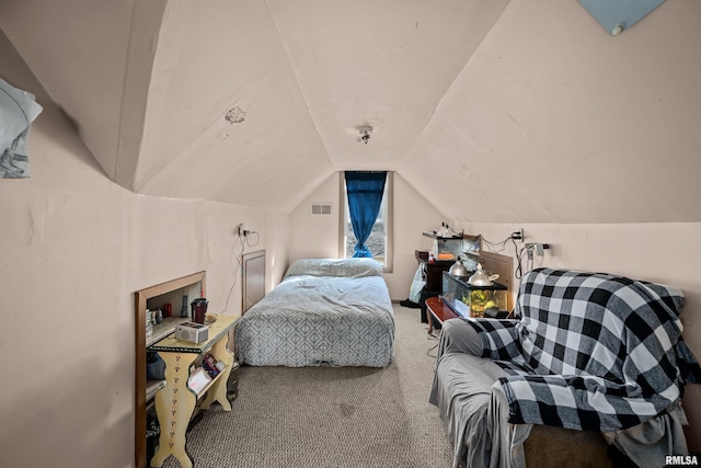 bedroom featuring lofted ceiling, carpet, and visible vents