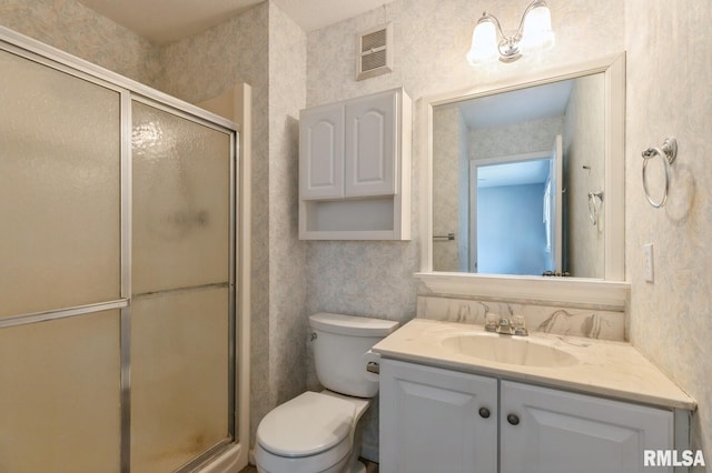 full bath featuring visible vents, toilet, a shower stall, vanity, and wallpapered walls