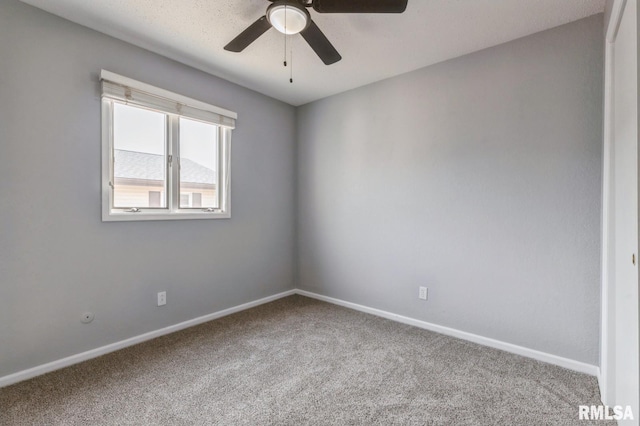 unfurnished room with ceiling fan, carpet floors, and baseboards