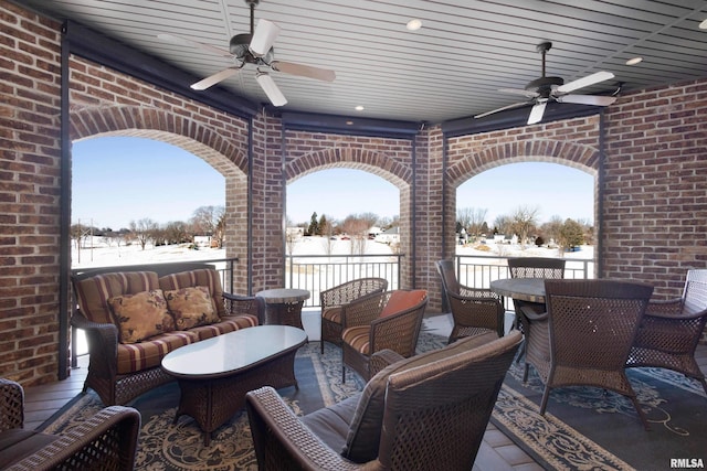 view of patio / terrace featuring an outdoor hangout area, outdoor dining area, and a ceiling fan