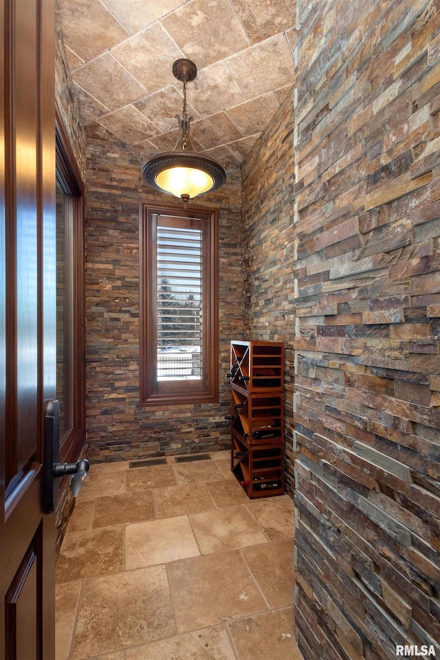 wine cellar featuring stone tile floors