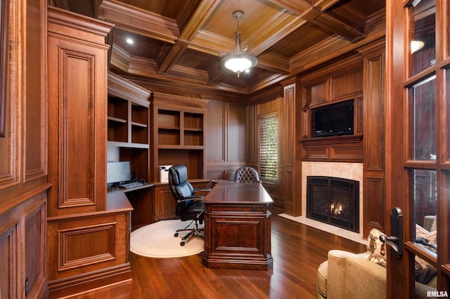 office space featuring wood ceiling, crown molding, beam ceiling, and a tile fireplace