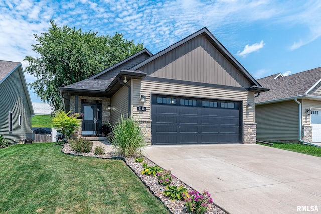 craftsman inspired home featuring a garage, driveway, stone siding, a front lawn, and board and batten siding