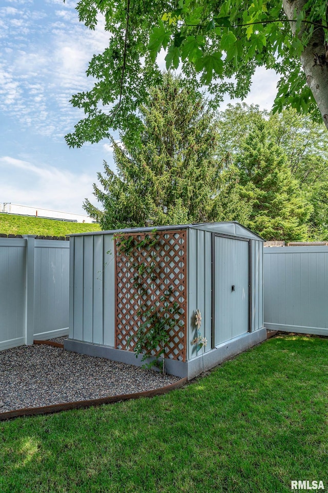 view of shed featuring a fenced backyard