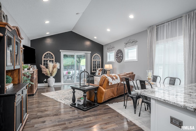 living area with lofted ceiling, dark wood-style floors, and recessed lighting