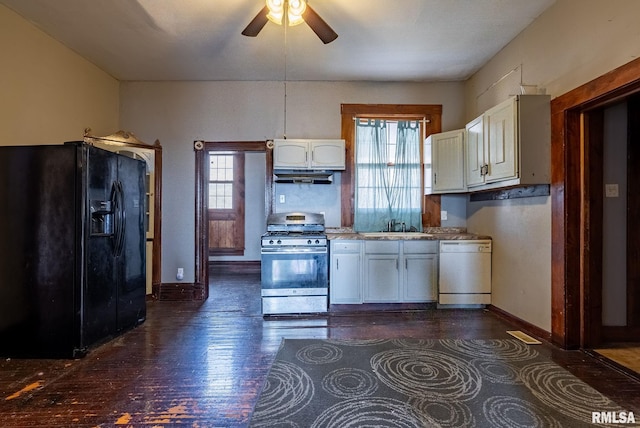 kitchen with white cabinets, dishwasher, gas range, black fridge, and a sink