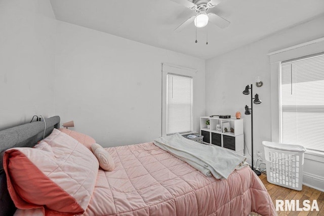 bedroom featuring ceiling fan and wood finished floors