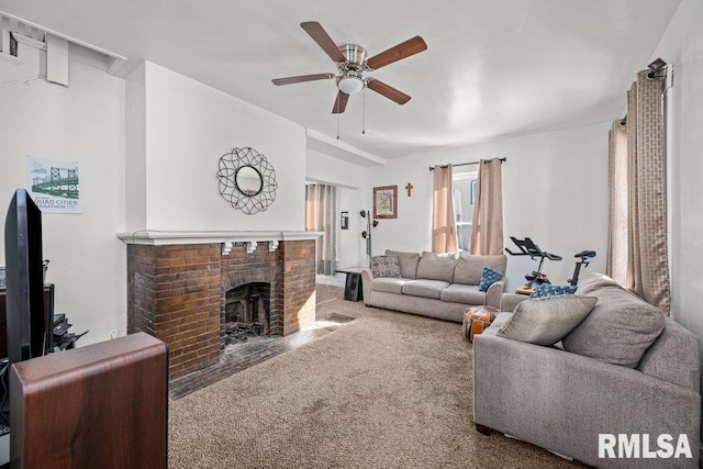 living area with carpet floors, a fireplace, and a ceiling fan