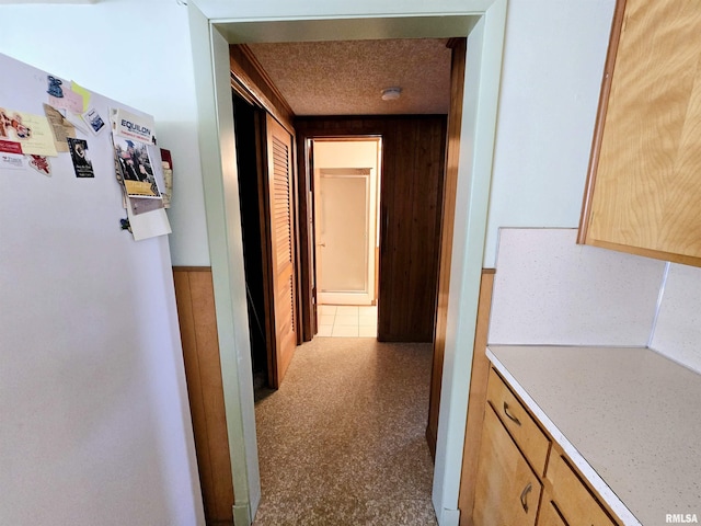 hallway featuring a textured ceiling