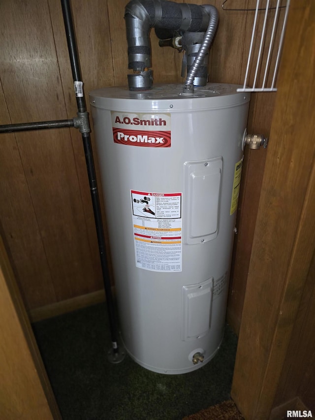 utility room featuring water heater