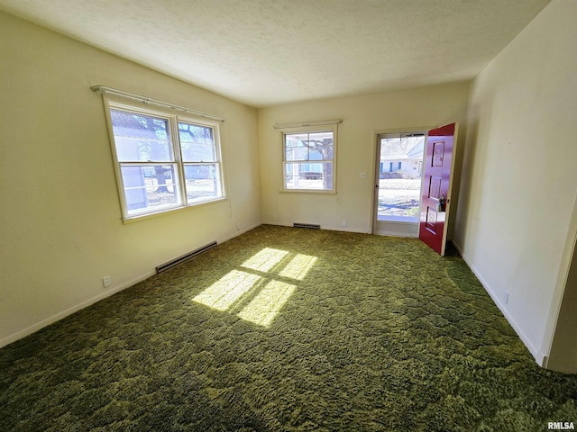 empty room featuring carpet floors, visible vents, and a textured ceiling