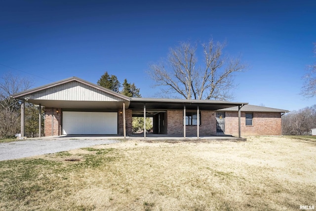 1595 Casper Church Rd, Cobden, IL 62920 - ranch-style home with a garage, brick siding, and gravel driveway