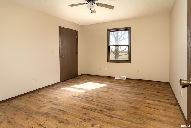 1595 Casper Church Rd, Cobden, IL 62920 - empty room featuring a ceiling fan, visible vents, baseboards, and wood-type flooring