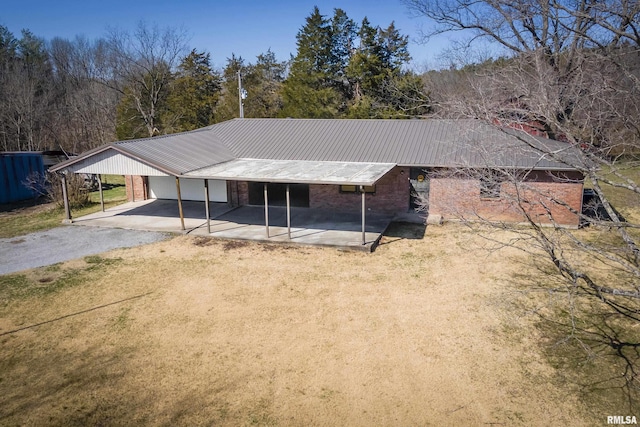 1595 Casper Church Rd, Cobden, IL 62920 - view of front of property featuring brick siding, driveway, metal roof, and a carport