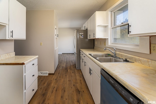 1595 Casper Church Rd, Cobden, IL 62920 - kitchen with visible vents, dark wood finished floors, a sink, white cabinets, and dishwasher