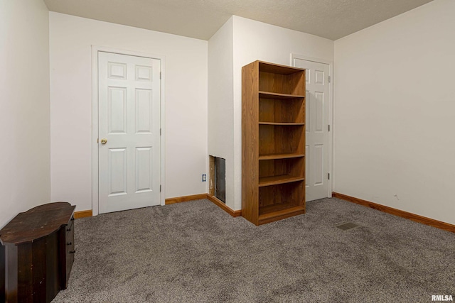 unfurnished bedroom with carpet flooring and baseboards