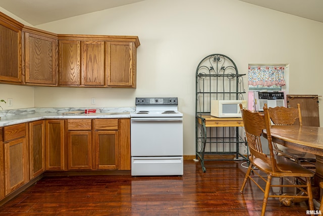 kitchen with white appliances, lofted ceiling, brown cabinets, dark wood-style flooring, and light countertops