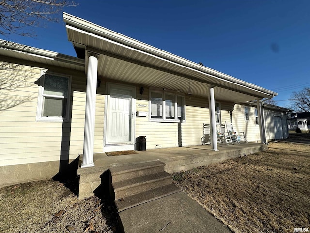 doorway to property featuring covered porch