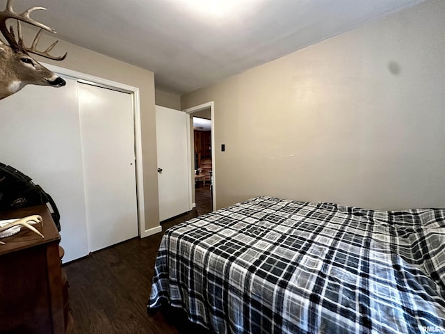 bedroom featuring a closet and wood finished floors