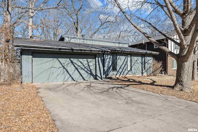 exterior space featuring a garage and driveway