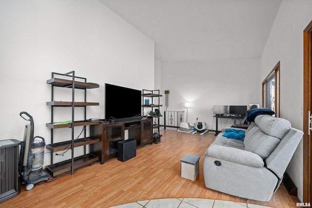 living room with baseboards and wood finished floors