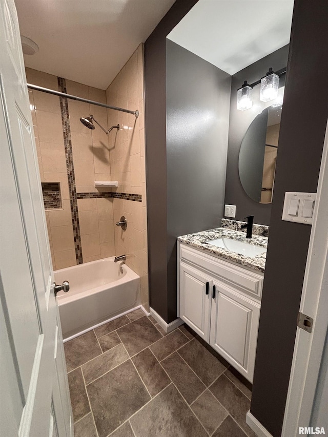 bathroom featuring shower / tub combination, vanity, and baseboards