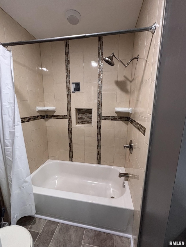 full bath with shower / tub combo and toilet