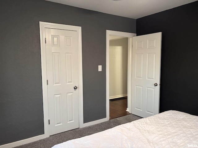 bedroom with carpet and baseboards