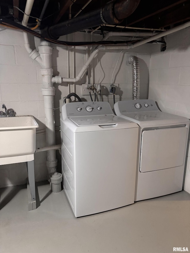 laundry room with laundry area and washing machine and clothes dryer