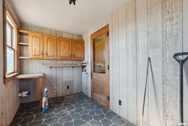 laundry room with stone finish flooring