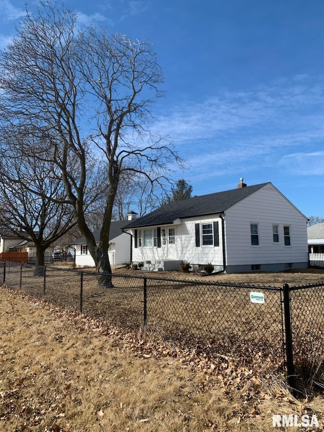 704 Washington St, New Windsor, IL 61465 - view of front facade featuring a fenced front yard and a chimney