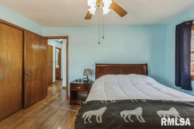 bedroom featuring wood-type flooring and a ceiling fan