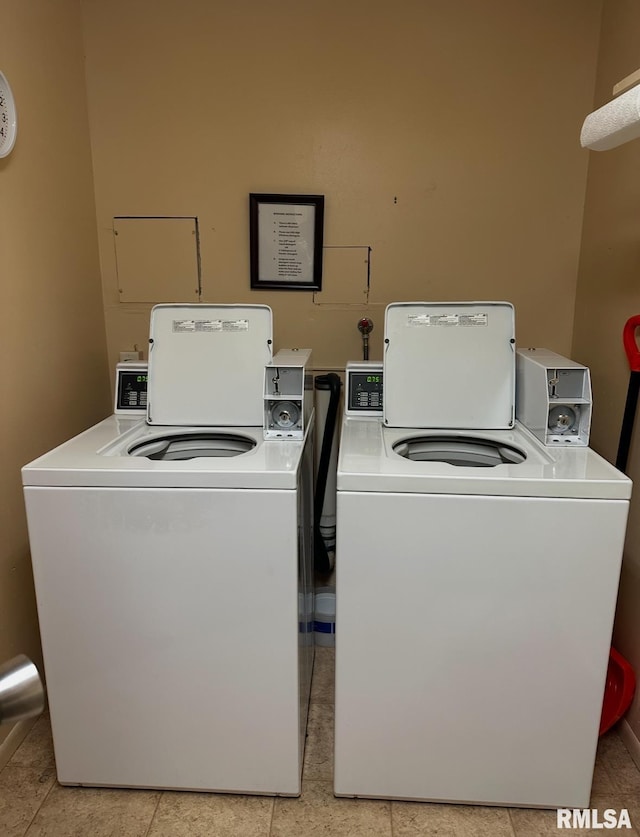 community laundry room featuring washer and clothes dryer