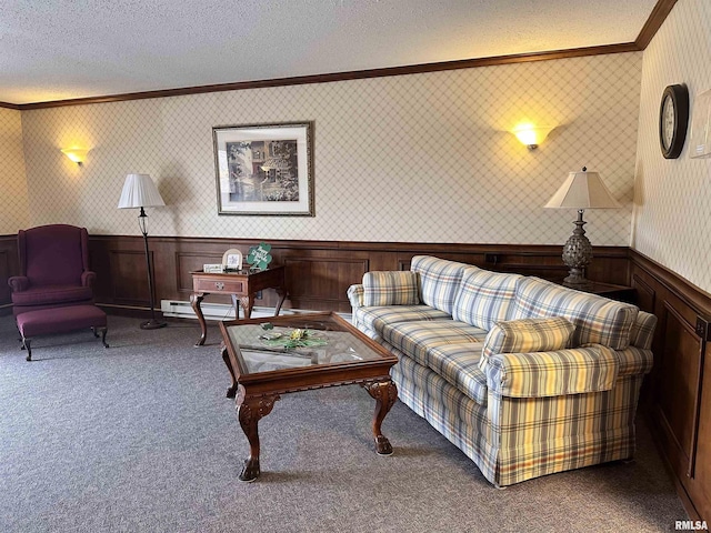 carpeted living area featuring wainscoting, a textured ceiling, wallpapered walls, and ornamental molding