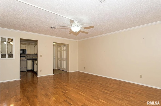 interior space with baseboards, ornamental molding, wood finished floors, a textured ceiling, and a ceiling fan
