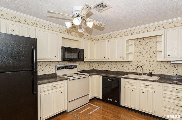 kitchen with visible vents, black appliances, open shelves, a sink, and dark countertops