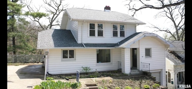 114 Dewhurst St, Savanna, IL 61074 - bungalow-style house featuring a shingled roof, fence, and a chimney