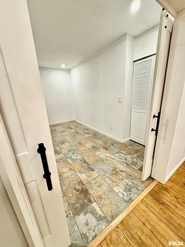 interior space with stone finish floor and baseboards