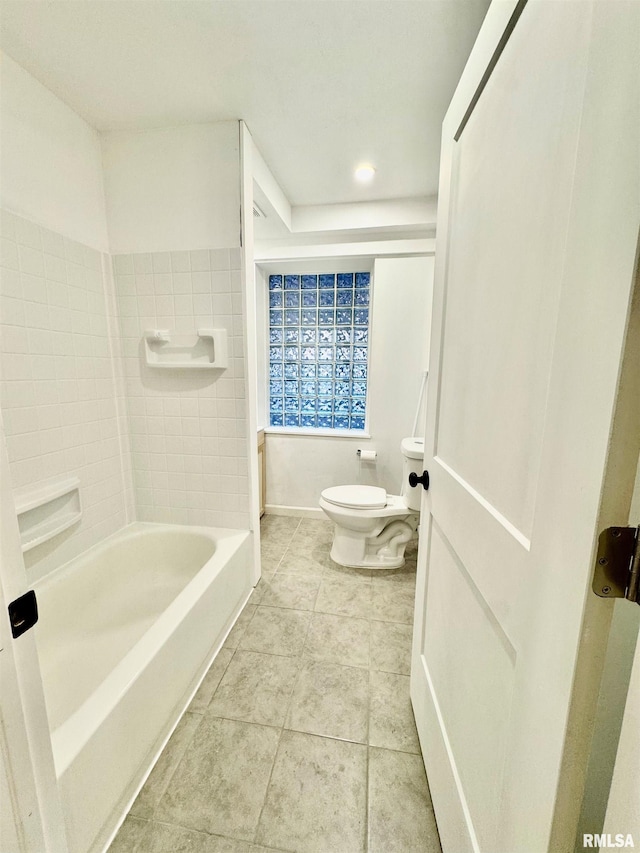 bathroom featuring tile patterned flooring and toilet