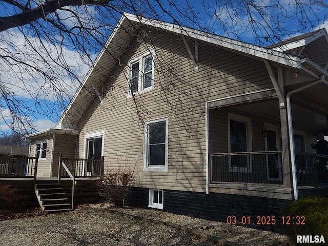 view of property exterior featuring a deck