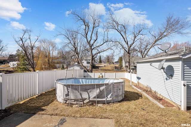 view of swimming pool featuring a fenced backyard and a fenced in pool