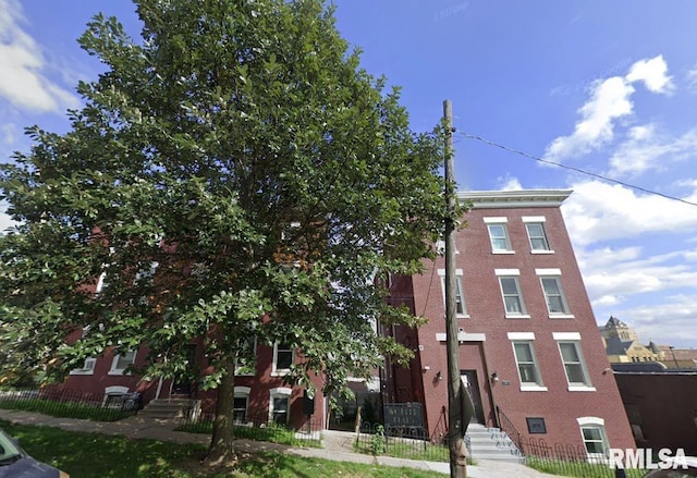 view of property featuring a fenced front yard