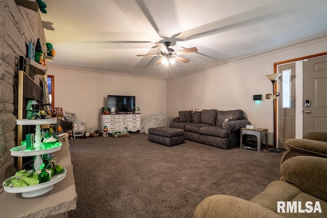 carpeted living room featuring ornamental molding and a ceiling fan