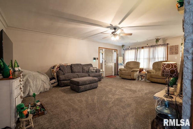 living room featuring a ceiling fan, carpet, and crown molding