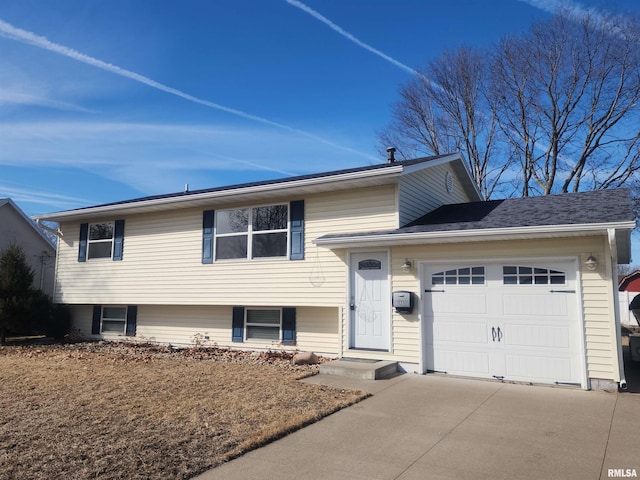 split level home with a garage and driveway