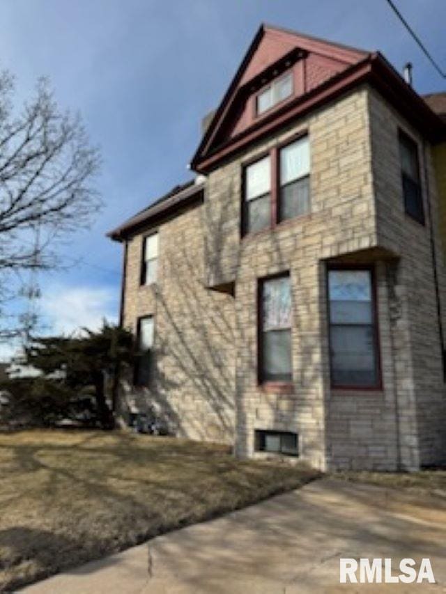 view of home's exterior featuring stone siding