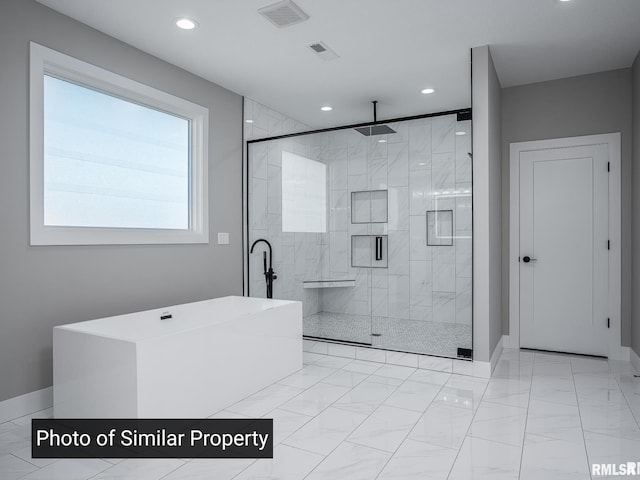 full bath with recessed lighting, visible vents, marble finish floor, a soaking tub, and a stall shower