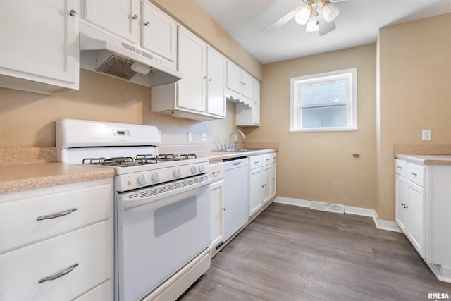 kitchen featuring visible vents, light wood-style floors, white cabinetry, white appliances, and under cabinet range hood